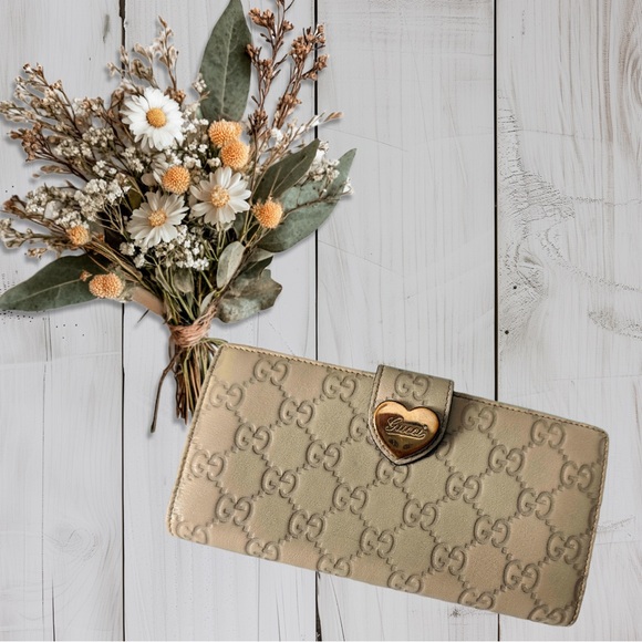 Gucci Handbags - Gucci Tan Monogram Clutch With Box and Authentication included Open to offers